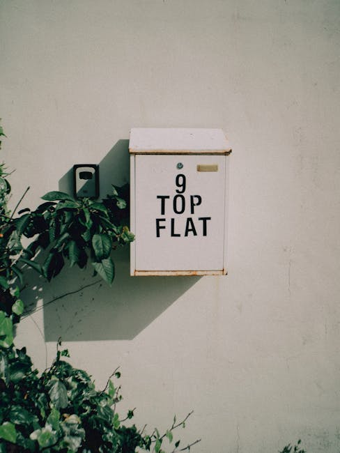 A pink mailbox with '9 TOP FLAT' text representing direct communication channels