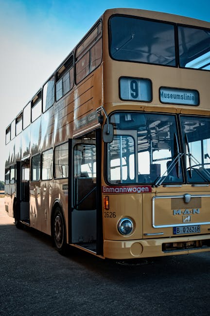 Vintage double-decker bus number 9 representing the fitness journey and community transport