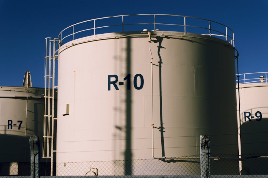 Industrial storage tanks R-9 and R-10 symbolizing mass energy and bulk nutritional planning