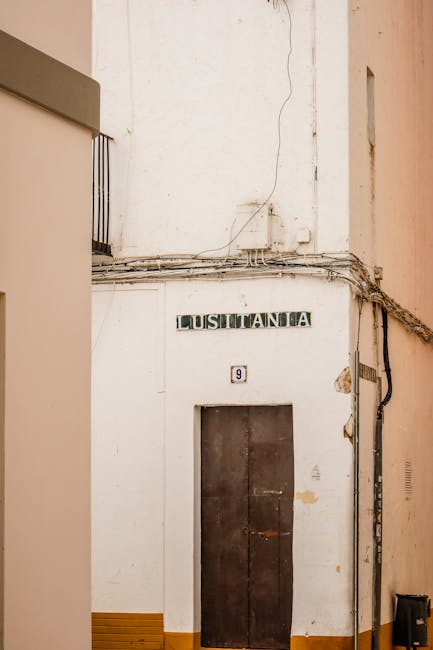 Minimalist white wall with a small number 9 sign signifying direct and clear answers